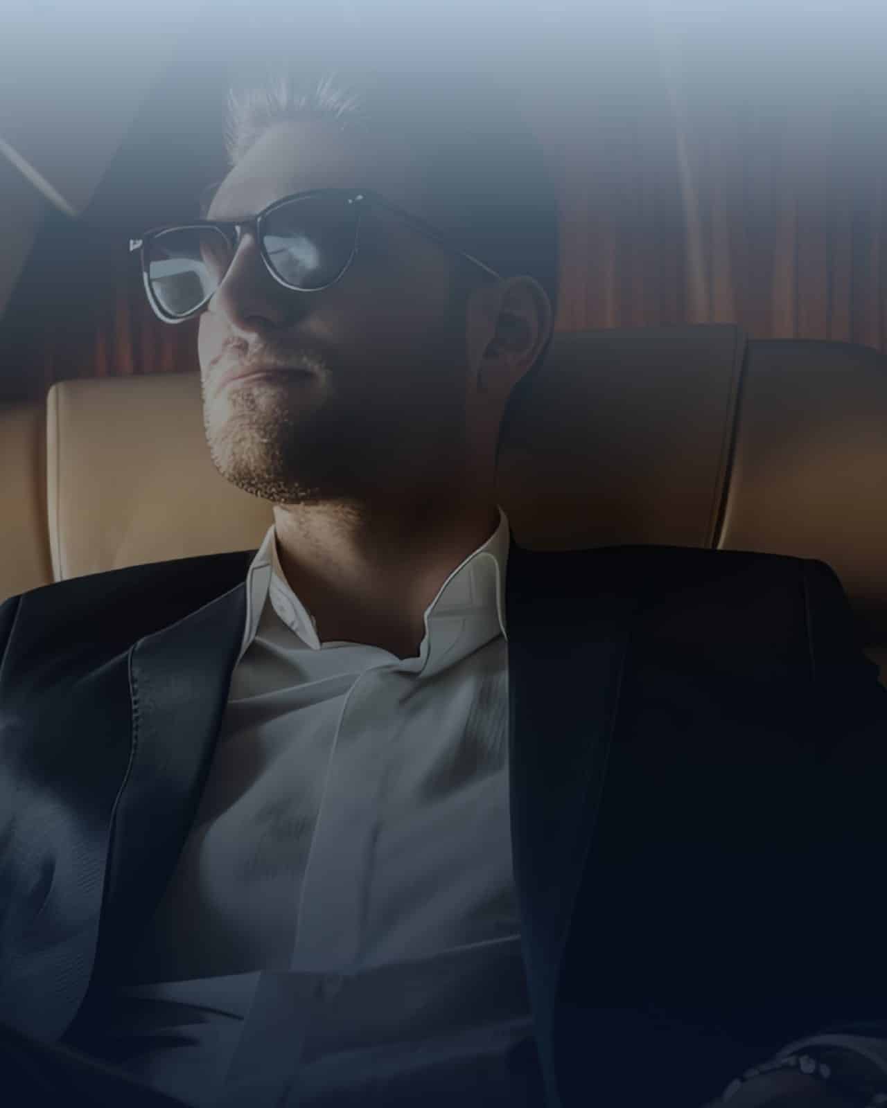 Owner seated in the cabin of a private jet